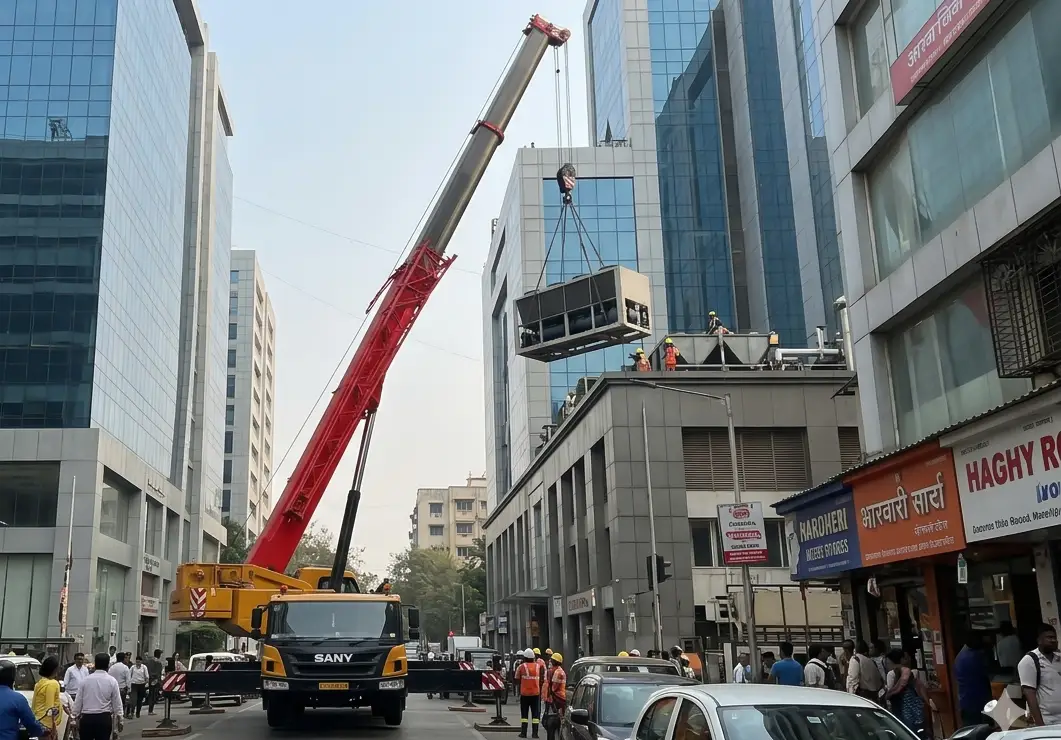 Telescopic crane lifting equipment in tight Mumbai commercial site